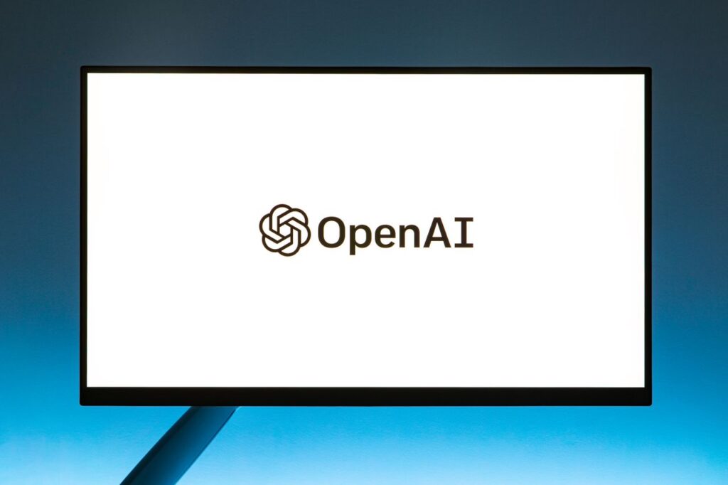Mastering the First Impression: Your intriguing post title goes here Minimalistic display of OpenAI logo on a monitor with a gradient blue background, representing modern technology.